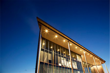 simsearch:6113-06721418,k - Modern building illuminated at dusk Stock Photo - Premium Royalty-Free, Code: 6113-06721429