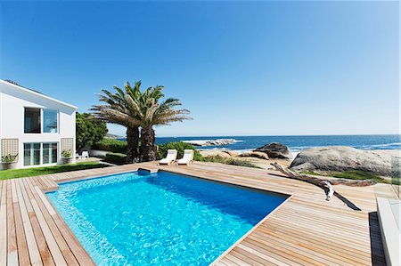 palm trees blue sky - Luxury swimming pool with ocean view Stock Photo - Premium Royalty-Free, Code: 6113-06898704