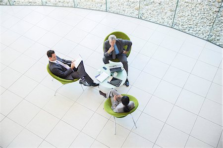 seated high view - High angle view of business people in meeting Stock Photo - Premium Royalty-Free, Code: 6113-06898992