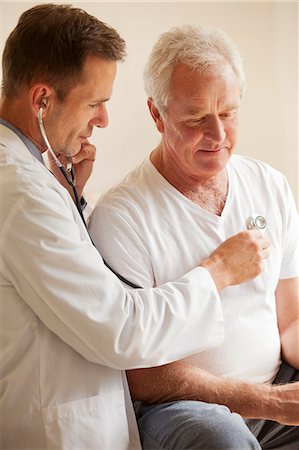 simsearch:695-05771248,k - Doctor checking senior man's heart with stethoscope Stock Photo - Premium Royalty-Free, Code: 6113-06898914