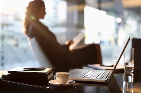 sunflare inside - Businesswoman using digital tablet in lobby Stock Photo - Premium Royalty-Free, Code: 6113-06899055