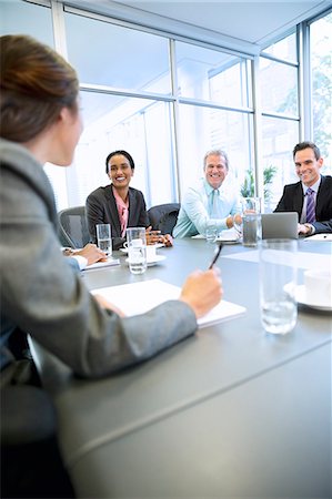 Smiling business people meeting in conference room Photographie de stock - Premium Libres de Droits, Code: 6113-06899159