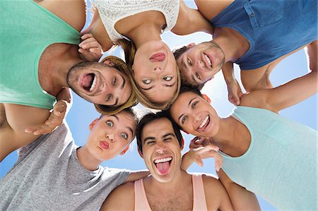 simsearch:6113-06908609,k - Low angle portrait of friends making silly faces Photographie de stock - Premium Libres de Droits, Code: 6113-06899180