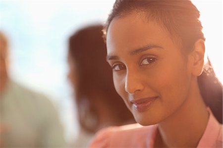 pretty indian woman image - Close up portrait of smiling businesswoman Stock Photo - Premium Royalty-Free, Code: 6113-06899106