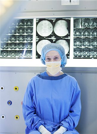 female medical glove - Surgeon sitting with x-rays Stock Photo - Premium Royalty-Free, Code: 6113-06908221