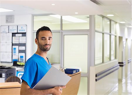 picture male nurse - Nurse smiling in hospital hallway Stock Photo - Premium Royalty-Free, Code: 6113-06908233