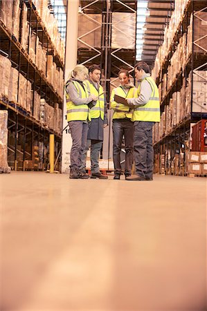 Workers talking in warehouse Stock Photo - Premium Royalty-Free, Code: 6113-06908466