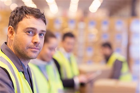 simsearch:6113-06908404,k - Worker standing in warehouse Stock Photo - Premium Royalty-Free, Code: 6113-06908413