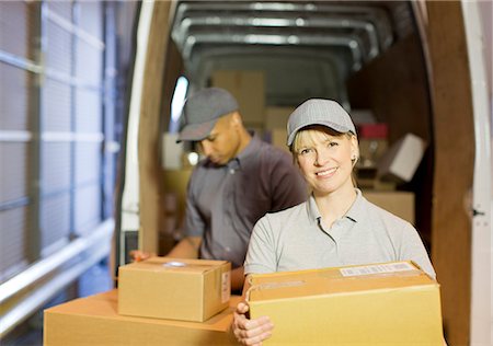 simsearch:6113-07648752,k - Delivery people loading boxes into van Stock Photo - Premium Royalty-Free, Code: 6113-06908435