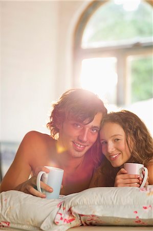 simsearch:6113-06908533,k - Couple having coffee together in bed Stock Photo - Premium Royalty-Free, Code: 6113-06908553