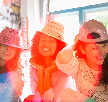 shopping - Women wearing hats in bedroom Stock Photo - Premium Royalty-Free, Code: 6113-06908511
