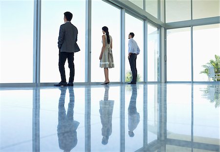 simsearch:6113-07242219,k - Reflections of business people in office floor Stock Photo - Premium Royalty-Free, Code: 6113-06908857