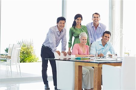 simsearch:6113-06908877,k - Business people smiling together in office Stock Photo - Premium Royalty-Free, Code: 6113-06908865