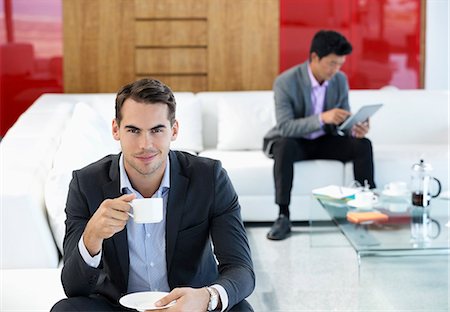 simsearch:6113-07565919,k - Businessman having cup of coffee in office Stock Photo - Premium Royalty-Free, Code: 6113-06908888