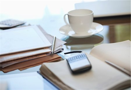 desk and coffee - Notebook, cell phone and cup of coffee on desk Stock Photo - Premium Royalty-Free, Code: 6113-06908819