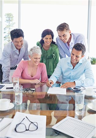 simsearch:6113-06908877,k - Business people signing contract in meeting Stock Photo - Premium Royalty-Free, Code: 6113-06908956