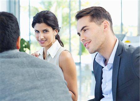 Business people talking in meeting Stock Photo - Premium Royalty-Free, Code: 6113-06908911