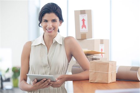 delivery business - Businesswoman using tablet computer in office Stock Photo - Premium Royalty-Free, Code: 6113-06908918