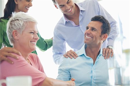 partner (activity) - Business people laughing in meeting Stock Photo - Premium Royalty-Free, Code: 6113-06909038