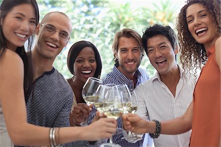 simsearch:614-06169407,k - Friends toasting each other at party Photographie de stock - Premium Libres de Droits, Code: 6113-06909142