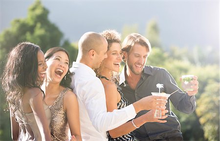 Friends laughing together at party Photographie de stock - Premium Libres de Droits, Code: 6113-06909160