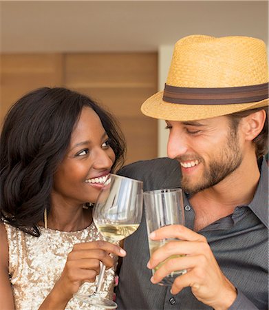 simsearch:6113-06909134,k - Couple toasting each other indoors Stock Photo - Premium Royalty-Free, Code: 6113-06909167