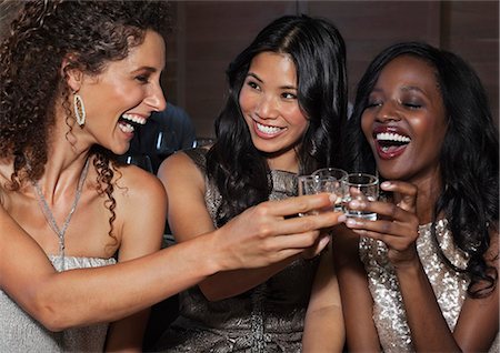 female front shot - Women toasting each other at party Stock Photo - Premium Royalty-Free, Code: 6113-06909116