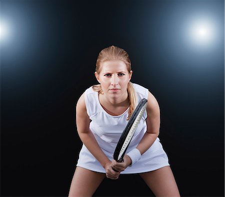 sports at night - Tennis player poised in game Stock Photo - Premium Royalty-Free, Code: 6113-06909281