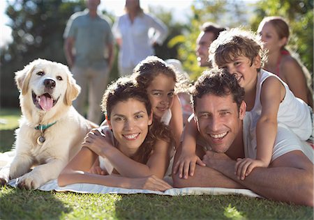 family dogs joy - Family relaxing in backyard Stock Photo - Premium Royalty-Free, Code: 6113-06909354