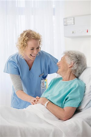 patient laughing - Nurse and senior patient talking in hospital room Stock Photo - Premium Royalty-Free, Code: 6113-07146770