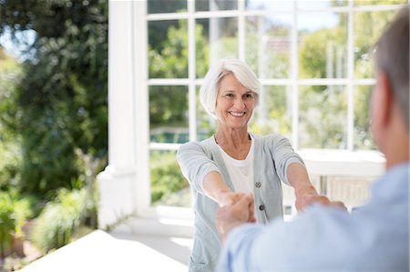 seniors dancing outside - Senior couple dancing on patio Stock Photo - Premium Royalty-Free, Code: 6113-07146855