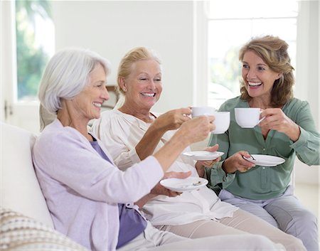 senior woman drinking coffee - Senior women toasting coffee cups Stock Photo - Premium Royalty-Free, Code: 6113-07146879