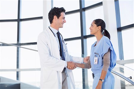Doctor and nurse handshaking Stock Photo - Premium Royalty-Free, Code: 6113-07146802