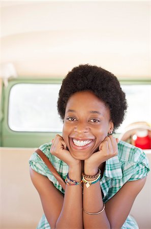 Portrait of smiling woman in back seat of camper van Stock Photo - Premium Royalty-Free, Code: 6113-07146995