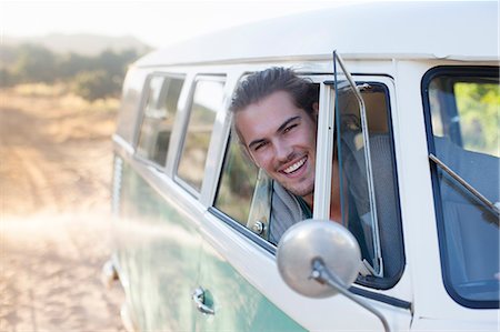 Man driving camper van on dirt road Stock Photo - Premium Royalty-Free, Code: 6113-07147073