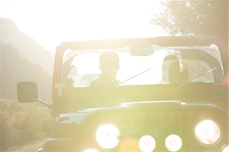 silhouette two people - Couple driving sport utility vehicle Stock Photo - Premium Royalty-Free, Code: 6113-07147095