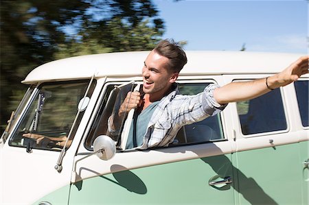 simsearch:6124-09269499,k - Man leaning head out camper van window Stock Photo - Premium Royalty-Free, Code: 6113-07147096