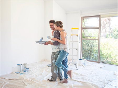 simsearch:6113-07147208,k - Couple painting walls Stock Photo - Premium Royalty-Free, Code: 6113-07147176