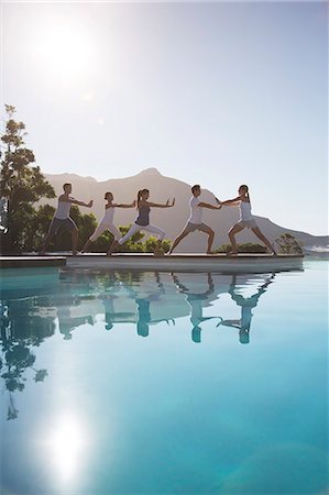 simsearch:6113-07147412,k - People practicing yoga at poolside Stock Photo - Premium Royalty-Free, Code: 6113-07147370