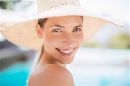 summer beauty woman - Portrait of smiling woman in sun hat Stock Photo - Premium Royalty-Free, Code: 6113-07147374