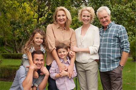 Portrait of multi-generation family smiling outdoors Stock Photo - Premium Royalty-Free, Code: 6113-07147673