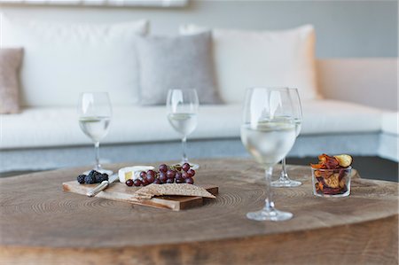 Wine and cheese on wooden coffee table Stock Photo - Premium Royalty-Free, Code: 6113-07147606