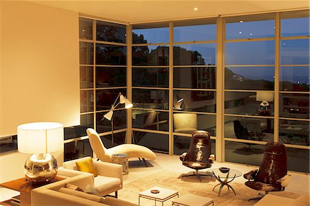 simsearch:6113-07147603,k - Modern living room with tall windows Foto de stock - Sin royalties Premium, Código: 6113-07147619