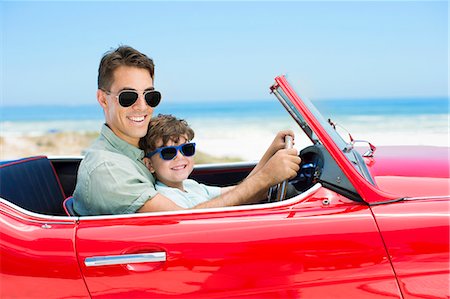 simsearch:6113-07242572,k - Father and son driving convertible on beach Stock Photo - Premium Royalty-Free, Code: 6113-07147792