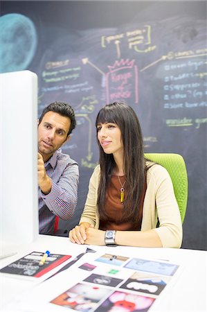 discussion of plan two women - Business people working at computer in office Stock Photo - Premium Royalty-Free, Code: 6113-07147897