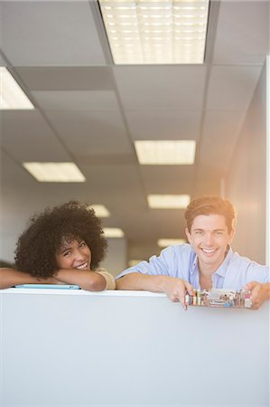 desk with wall - Portrait of smiling business people holding circuit board in office Photographie de stock - Premium Libres de Droits, Code: 6113-07147949