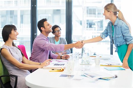 simsearch:6113-09111915,k - Business people shaking hands in meeting Stock Photo - Premium Royalty-Free, Code: 6113-07147901