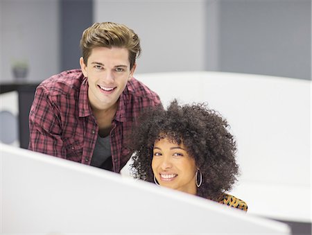 proud young man - Portrait of smiling business people in office Stock Photo - Premium Royalty-Free, Code: 6113-07147917