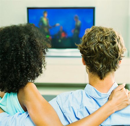 simsearch:614-06898605,k - Couple watching television on sofa Stock Photo - Premium Royalty-Free, Code: 6113-07148042