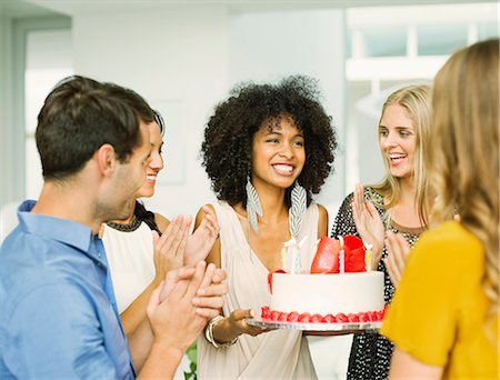 Friends clapping around woman with birthday cake Stockbilder - Premium RF Lizenzfrei, Bildnummer: 6113-07148045